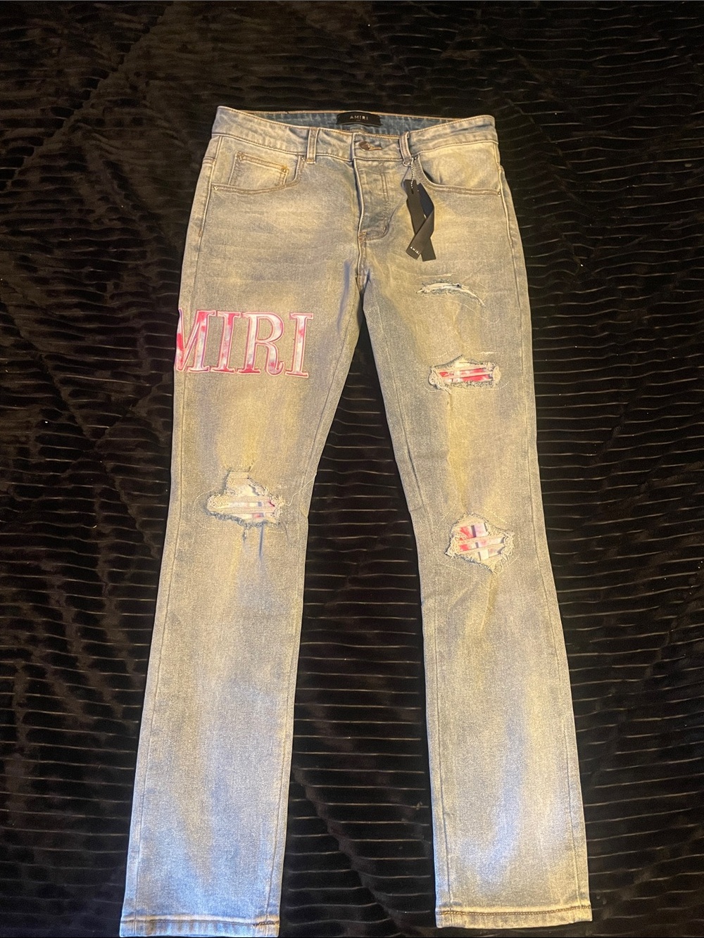 AMIRI Light Gray Distressed Jeans with Pink Logo Patch